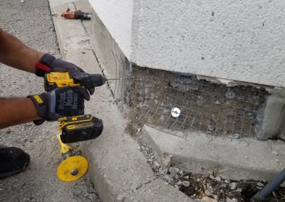 Person repairing wall